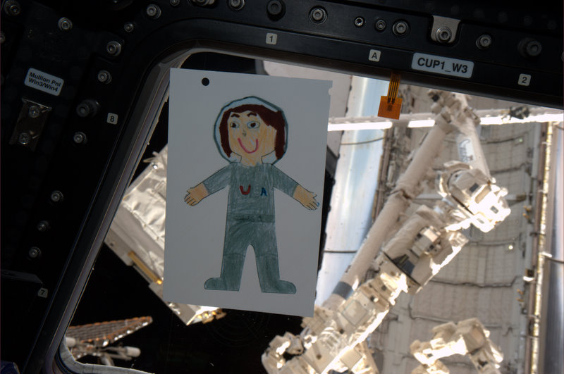 Flat Samantha in the ISS Cupola (photo by Gregory Johnson)